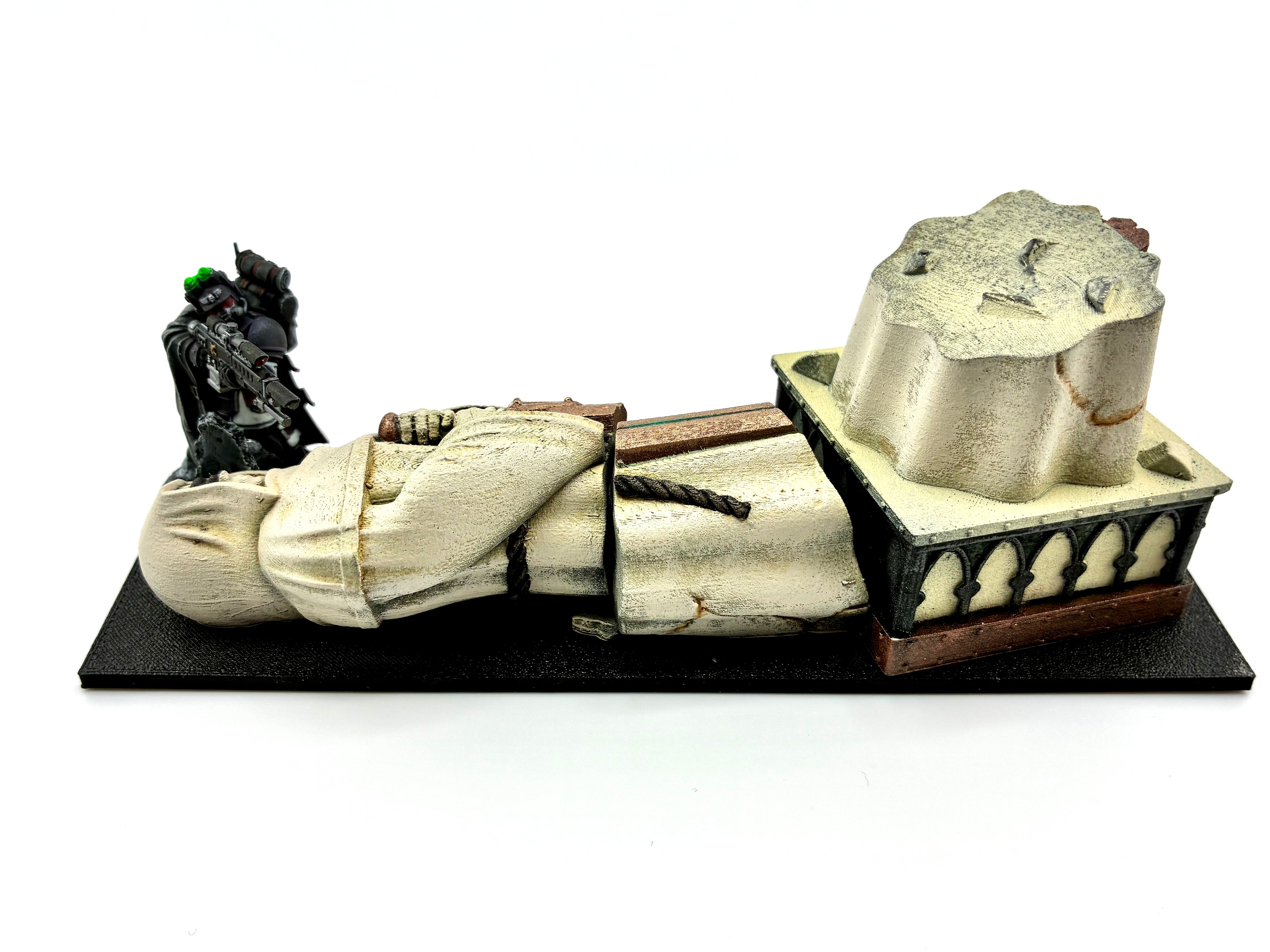Fallen statue terrain with a kasrkin behind